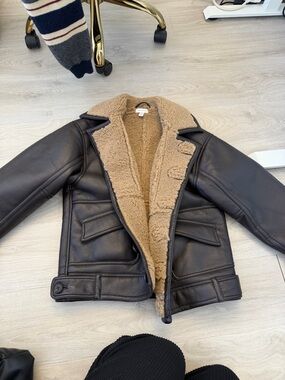 Woman’s Black Leather Shearling Jacket with Tan Lining